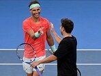 Spain's Rafael Nadal (L) shakes hands with partner Marc Lopez after losing their men's doubles match against Australia's Max Purcell and Jordan Thompson at the Brisbane International tennis tournament in Brisbane on December 31