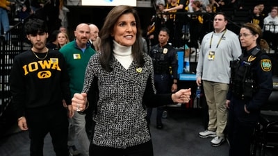 Republican presidential candidate Nikki Haley arrives at an NCAA college basketball game between Iowa and Minnesota, Saturday, Dec. 30, 2023, in Iowa City, Iowa. (AP Photo/Charlie Neibergall) (AP) Republican presidential candidate Nikki Haley arrives at an NCAA college basketball game between Iowa and Minnesota, Saturday, Dec. 30, 2023, in Iowa City, Iowa. (AP Photo/Charlie Neibergall) (AP)