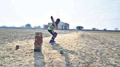The dusty cricket pitch at the ramshackle district sports stadium in Shahpur Nagli village in Nuh district. (Parveen Kumar/HT Photo) The dusty cricket pitch at the ramshackle district sports stadium in Shahpur Nagli village in Nuh district. (Parveen Kumar/HT Photo)
