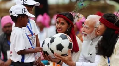 PM interacts with the kids at Pakaria village in Shahdol, Madhya Pradesh. The children were young players of "Football Kranti", a programme run by the local administration. Prime Minister Modi also engaged with a group of individuals, including women, who shared their experiences of achieving economic empowerment through Self-Help Groups (SHGs) and the ‘Ajivika Mission.’ (narendramodi.in) PM interacts with the kids at Pakaria village in Shahdol, Madhya Pradesh. The children were young players of "Football Kranti", a programme run by the local administration. Prime Minister Modi also engaged with a group of individuals, including women, who shared their experiences of achieving economic empowerment through Self-Help Groups (SHGs) and the ‘Ajivika Mission.’ (narendramodi.in)