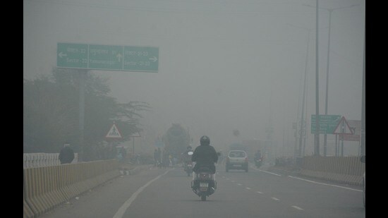 Commuters brave the foggy weather in Panchkula on Sunday. With dense fog in the city, day temperature continued to plunge, going down from 15.1°C on Saturday to 12.4°C on Sunday, the lowest of the season. As per the India Meteorological department (IMD), this was the first severe cold day of the season, a day after the first cold day was also recorded. (Sant Arora/ HT Photo)