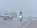 New Delhi , India - December 30 2023: Commuters out on a cold and Foggy morning amid rising air pollution levels at Ghazipur area in New Delh , India on Saturday, December 30 2023. (Photo by Sakib Ali /Hindustan Times)