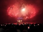 People watch the New Year's fireworks display over Toronto's inner harbor just after midnight, on Monday, Jan. 1, 2024, in Toronto. (Arlyn McAdorey/The Canadian Press via AP) People watch the New Year's fireworks display over Toronto's inner harbor just after midnight, on Monday, Jan. 1, 2024, in Toronto. (Arlyn McAdorey/The Canadian Press via AP)