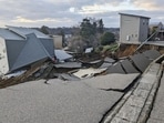 A view of a collapsed road and houses because of an earthquake in Wajima, Ishikawa prefecture, Japan January 1, 2024, in this photo released by Kyodo. 