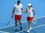 Poland's Iga Swiatek speaks to partner Hubert Hurkacz during their mixed doubles match against Spain's Sara Sorribes Tormo and Alejandro Davidovich Fokina at the United Cup tennis tournament in Perth on January 1 Poland's Iga Swiatek speaks to partner Hubert Hurkacz during their mixed doubles match against Spain's Sara Sorribes Tormo and Alejandro Davidovich Fokina at the United Cup tennis tournament in Perth on January 1