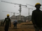 TOPSHOT - Workers are pictured at the construction site of a temple to Hindu deity Ram, in Ayodhya on December 29, 2023. (Photo by Arun SANKAR / AFP) TOPSHOT - Workers are pictured at the construction site of a temple to Hindu deity Ram, in Ayodhya on December 29, 2023. (Photo by Arun SANKAR / AFP)