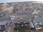 This grab of a video that surfaced on social media purportedly shows a building collapsing during a strong earthquake in Ishikawa prefecture in Japan..