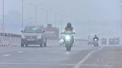 New Delhi , India - December 30  2023: Commuters out on a cold and Foggy morning amid rising air pollution levels at Ghazipur area  in New Delh , India on Saturday, December 30 2023. (Photo by Sakib Ali /Hindustan Times)