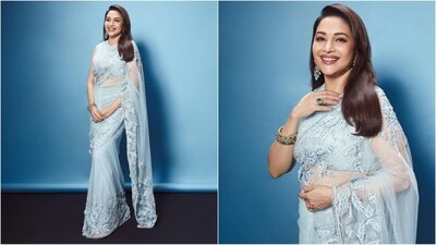 Madhuri Dixit is one of those actresses who continue to age like a fine wine. The stylish actress is a total stunner who can pull off any look to perfection, be it a chic pantsuit or a casual mini dress. Madhuri is known for her ethnic sartorial sense and continues to set fashion targets with her mesmerising saree and suit looks. She is quite active on social media and her Insta-diaries filled with fashion-forward looks are nothing short of a treasure trove of style inspiration for all her followers. Her latest look, draped in a six-yard grace, is no exception and is sure to inspire your ethnic wardrobe. Scroll down to take notes. (Instagram/@madhuridixitnene) Madhuri Dixit is one of those actresses who continue to age like a fine wine. The stylish actress is a total stunner who can pull off any look to perfection, be it a chic pantsuit or a casual mini dress. Madhuri is known for her ethnic sartorial sense and continues to set fashion targets with her mesmerising saree and suit looks. She is quite active on social media and her Insta-diaries filled with fashion-forward looks are nothing short of a treasure trove of style inspiration for all her followers. Her latest look, draped in a six-yard grace, is no exception and is sure to inspire your ethnic wardrobe. Scroll down to take notes. (Instagram/@madhuridixitnene)