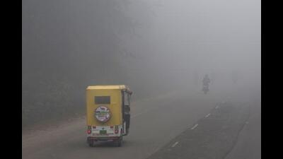 A three-wheeler drives through dense fog in Lucknow, India. (AP Photo/Rajesh Kumar Singh) (AP FILE PHOTO)