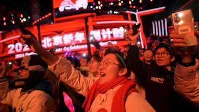 New Year 2024: Revellers celebrate the New Year during a countdown event in Beijing. (AFP) New Year 2024: Revellers celebrate the New Year during a countdown event in Beijing. (AFP)