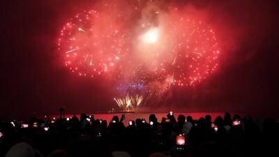 People watch the New Year's fireworks display over Toronto's inner harbor just after midnight, on Monday, Jan. 1, 2024, in Toronto. (Arlyn McAdorey/The Canadian Press via AP) (AP)