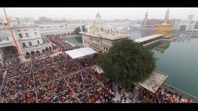 Devotees in large numbers wait to offer prayers on the first day of the year 2024, at the Golden Temple in Amritsar on Monday. (Sameer Sehgal/HT) Devotees in large numbers wait to offer prayers on the first day of the year 2024, at the Golden Temple in Amritsar on Monday. (Sameer Sehgal/HT)