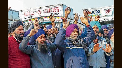 Members of the All J&K Oil Tankers Association raise slogans during a protest in Jammu on Monday. (PTI) Members of the All J&K Oil Tankers Association raise slogans during a protest in Jammu on Monday. (PTI)