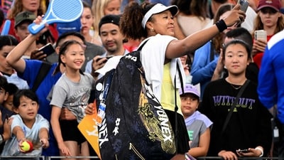 Japan's Naomi Osaka (R) takes a selfie with fans after victory during her women's singles match against Germany's Tamara Korpatsch at the Brisbane International tennis tournament in Brisbane on January 1, 2024 (AFP) Japan's Naomi Osaka (R) takes a selfie with fans after victory during her women's singles match against Germany's Tamara Korpatsch at the Brisbane International tennis tournament in Brisbane on January 1, 2024 (AFP)