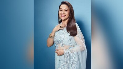 Assisted by make-up artist Billy Manik, Madhuri got decked up in nude eyeshadow, mascaraed lashes, winged eyeliner, darkened brows, contoured cheeks, luminious highlighter and a shade of glossy berry lisptick. (Instagram/@madhuridixitnene) Assisted by make-up artist Billy Manik, Madhuri got decked up in nude eyeshadow, mascaraed lashes, winged eyeliner, darkened brows, contoured cheeks, luminious highlighter and a shade of glossy berry lisptick. (Instagram/@madhuridixitnene)