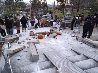 A torii gate is damaged after an earthquake at a shrine in Kanazawa, Ishikawa prefecture, (AP) A torii gate is damaged after an earthquake at a shrine in Kanazawa, Ishikawa prefecture, (AP)