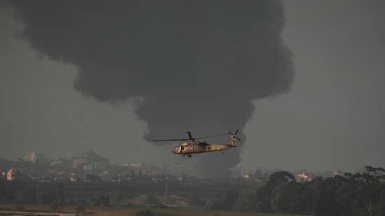 An Israeli military helicopter flies near the Israeli-Gaza border, as seen from southern Israel, Monday, Jan. 1, 2024. The army is battling Palestinian militants across Gaza in the war ignited by Hamas' Oct. 7 attack into Israel. (AP/PTI) (AP01_01_2024_000303A) (AP)