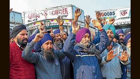 Members of the All J&K Oil Tankers Association raise slogans during a protest in Jammu on Monday. (PTI)