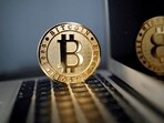 A bitcoin is seen in an illustration picture taken at La Maison du Bitcoin in Paris.