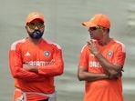 India head coach Rahul Dravid and captain Rohit Sharma converse during a practice session