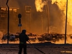 Russia-Ukraine War: A firefighter works to extinguish a fire after a Russian attack in Kyiv, Ukraine. Russia-Ukraine War: A firefighter works to extinguish a fire after a Russian attack in Kyiv, Ukraine.