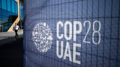 A man walks past a COP28 sign at the venue of the United Nations climate summit in Dubai on November 30, 2023. The UN climate conference opens in Dubai on November 30 with nations under pressure to increase the urgency of action on global warming and wean off fossil fuels, amid intense scrutiny of oil-rich hosts UAE. (AFP) A man walks past a COP28 sign at the venue of the United Nations climate summit in Dubai on November 30, 2023. The UN climate conference opens in Dubai on November 30 with nations under pressure to increase the urgency of action on global warming and wean off fossil fuels, amid intense scrutiny of oil-rich hosts UAE. (AFP)