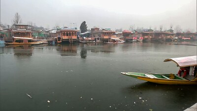 A thin sheet of ice forms in the upper layer of the Dal Lake as Jammu and Kashmir recorded minus 4.8 degrees Celsius in Srinagar on Tuesday. (ANI)