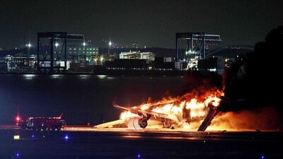 Japan plane fire: Live footage on public broadcaster NHK showed the aircraft erupt in flames as it skidded down the tarmac despite feverish efforts by rescue crews to control the blaze. (AFP)