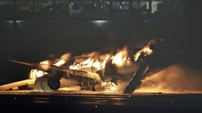 Fire at Japan Airport: A Japan Airlines plane is on fire on the runway of Haneda airport in Tokyo, Japan. (AP) Fire at Japan Airport: A Japan Airlines plane is on fire on the runway of Haneda airport in Tokyo, Japan. (AP)