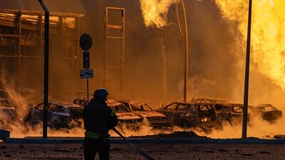Russia-Ukraine War: A firefighter works to extinguish a fire after a Russian attack in Kyiv, Ukraine. (AP) Russia-Ukraine War: A firefighter works to extinguish a fire after a Russian attack in Kyiv, Ukraine. (AP)