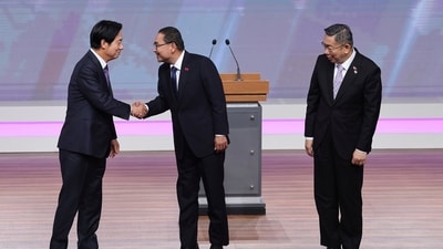 Taiwan President and Democratic Progressive Party presidential candidate William Lai, from left, shakes hands with Taiwan's Nationalist Party presidential candidate Hou Yu-ih while Taiwan's Taiwan People's Party (TPP) presidential candidate Ko Wen-je stands by before the presidential debates at Taiwan Public Television Service in Taipei, Taiwan, Saturday, Dec. 30, 2023. Taiwan will hold its presidential election on Jan. 13, 2024. (AP Photo/Pei Chen, Pool) (AP) Taiwan President and Democratic Progressive Party presidential candidate William Lai, from left, shakes hands with Taiwan's Nationalist Party presidential candidate Hou Yu-ih while Taiwan's Taiwan People's Party (TPP) presidential candidate Ko Wen-je stands by before the presidential debates at Taiwan Public Television Service in Taipei, Taiwan, Saturday, Dec. 30, 2023. Taiwan will hold its presidential election on Jan. 13, 2024. (AP Photo/Pei Chen, Pool) (AP)