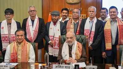 Union Home Minister Amit Shah and Assam Chief Minister Himanta Biswa Sarma with members of United Liberation Front of Asom (ULFA) during signing of a peace accord between ULFA and the central and Assam governments, in New Delhi, Friday. (PTI) Union Home Minister Amit Shah and Assam Chief Minister Himanta Biswa Sarma with members of United Liberation Front of Asom (ULFA) during signing of a peace accord between ULFA and the central and Assam governments, in New Delhi, Friday. (PTI)