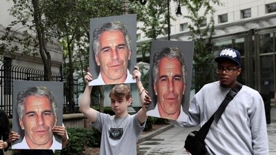 (File) Demonstrators hold signs aloft protesting against Jeffrey Epstein (Reuters) (File) Demonstrators hold signs aloft protesting against Jeffrey Epstein (Reuters)