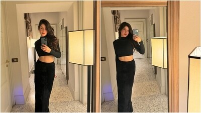 Earlier, Shanaya had posted another set of pictures from Milan with the caption, "Mirror, mirror on the wall [bunny emoji]." She wore an all-black ensemble - a cropped blouse and a matching skirt - for the mirror selfies. While the top has a turtle neckline, full-length sleeves, cropped hem, and a fitted design, the velvet skirt features a high-rise waist, a figure-hugging fit, a back slit, and a floor-length hem.&nbsp; (Instagram)