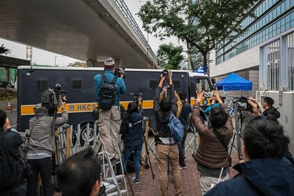 Journalists film a prison van carrying activist publisher Jimmy Lai as it enters the West Kowloon Magistrates' Courts where Lai's trial takes place in Hong Kong, Tuesday, Jan. 2, 2024. (AP) Journalists film a prison van carrying activist publisher Jimmy Lai as it enters the West Kowloon Magistrates' Courts where Lai's trial takes place in Hong Kong, Tuesday, Jan. 2, 2024. (AP)