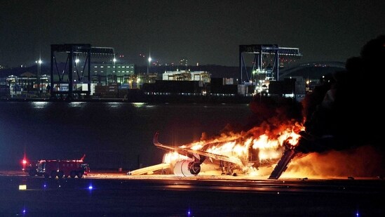 Japan plane fire: Live footage on public broadcaster NHK showed the aircraft erupt in flames as it skidded down the tarmac despite feverish efforts by rescue crews to control the blaze.(AFP)