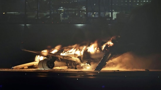 Japan plane fire: A Japan Airlines jet was engulfed in flames at Tokyo's Haneda airport on Tuesday after a possible collision with a Coast Guard aircraft.(AP)