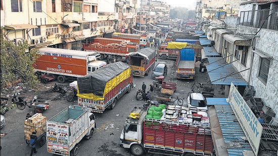 Trucks parked inside the Azadpur mandi in Delhi on Tuesday. (Sanchit Khanna/HT Photo)