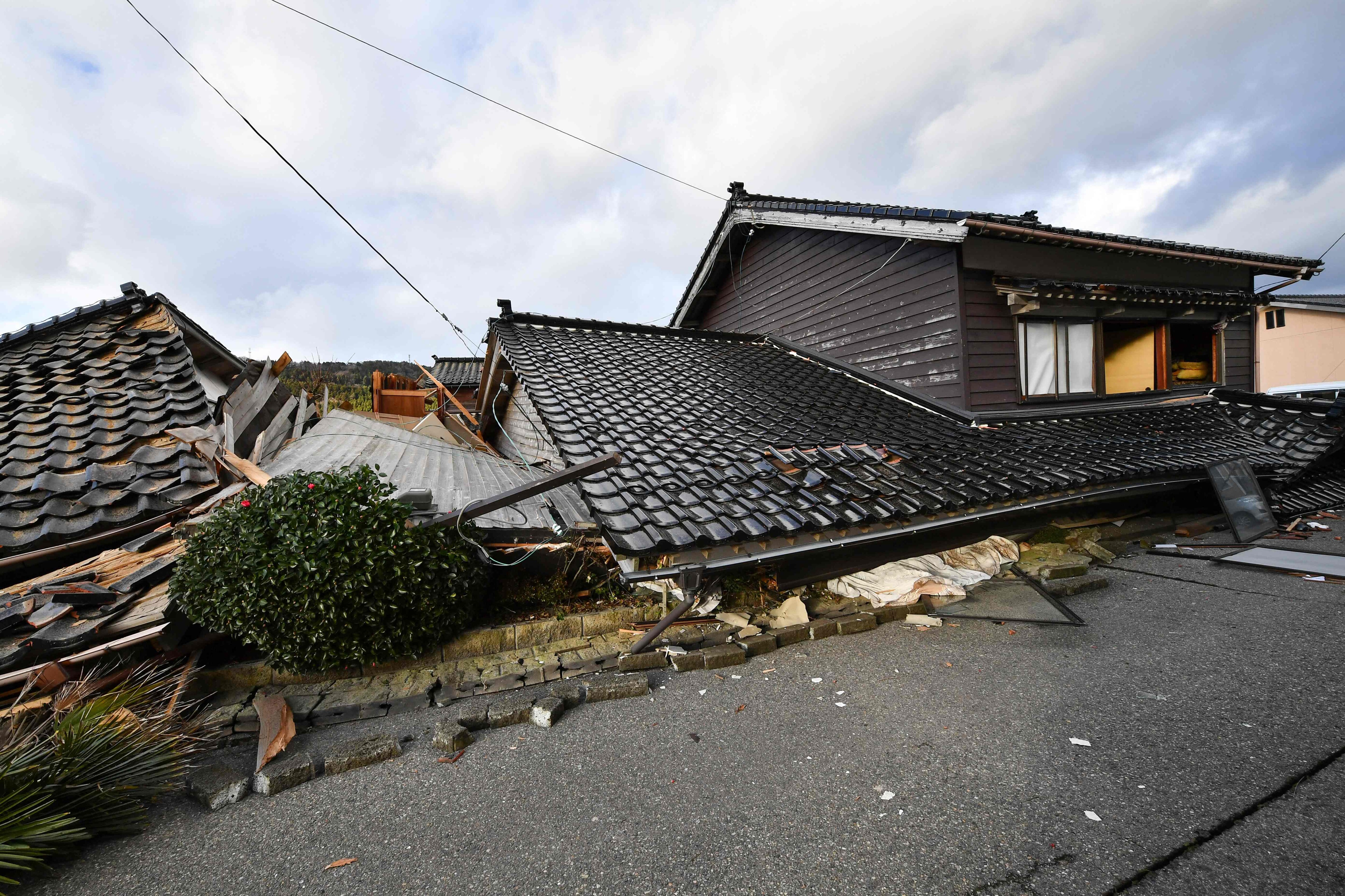 Collapsed wooden houses are seen in Wajima, Ishikawa prefecture on January 2, 2024. (AFP) Collapsed wooden houses are seen in Wajima, Ishikawa prefecture on January 2, 2024. (AFP)