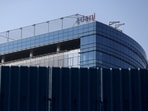 A logo of the Adani Group is seen on a commercial complex in Mumbai.
