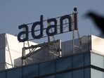 A logo of the Adani Group is seen on a commercial complex. A logo of the Adani Group is seen on a commercial complex.