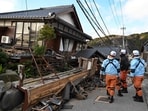 Firefighters inspect collapsed wooden houses in Wajima, Ishikawa prefecture on January 2, 2024. Firefighters inspect collapsed wooden houses in Wajima, Ishikawa prefecture on January 2, 2024.