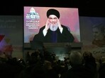 People watch the televised speech of Lebanon's Hezbollah chief Hasan Nasrallah. People watch the televised speech of Lebanon's Hezbollah chief Hasan Nasrallah.