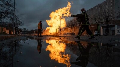 A firefighter works to extinguish a fire from a gas pipe line damaged by a Russian rocket attack, in Kyiv, Ukraine. (AP) A firefighter works to extinguish a fire from a gas pipe line damaged by a Russian rocket attack, in Kyiv, Ukraine. (AP)