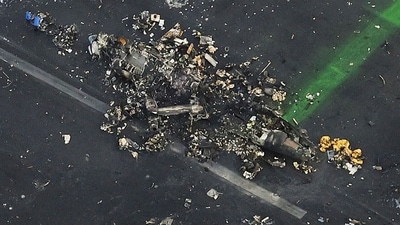 Japan Plane Accident: This aerial photo shows the burn-out Japanese coast guard aircraft at Haneda airport. (AP) Japan Plane Accident: This aerial photo shows the burn-out Japanese coast guard aircraft at Haneda airport. (AP)