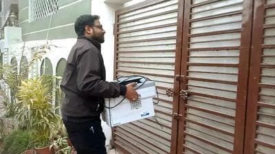 An ED official arrives with a currency counting machine at the house of Abhishek Prasad, Jharkhand CM Hemant Soren's press advisor, in Ranchi on Wednesday. Prasad’s house was among the multiple locations searched. (ANI) An ED official arrives with a currency counting machine at the house of Abhishek Prasad, Jharkhand CM Hemant Soren's press advisor, in Ranchi on Wednesday. Prasad’s house was among the multiple locations searched. (ANI)