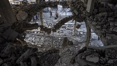 Israel-Hamas War: Palestinians look at the destruction after an Israeli strike in Rafah, southern Gaza Strip. (AP) Israel-Hamas War: Palestinians look at the destruction after an Israeli strike in Rafah, southern Gaza Strip. (AP)
