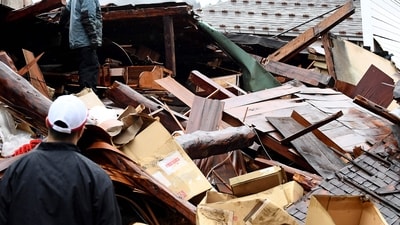 Japan Earthquake: Residents clean debris in Anamizu town, Ishikawa prefecture after a major quake hit Japan. (AFP) Japan Earthquake: Residents clean debris in Anamizu town, Ishikawa prefecture after a major quake hit Japan. (AFP)