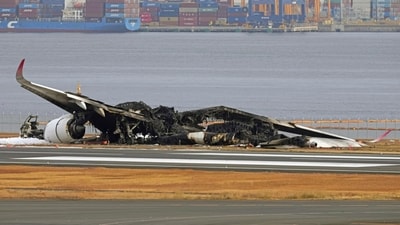 Japan Plane Accident: The burn-out Japan Airlines plane is seen at Haneda airport in Tokyo, Japan. (AP) Japan Plane Accident: The burn-out Japan Airlines plane is seen at Haneda airport in Tokyo, Japan. (AP)